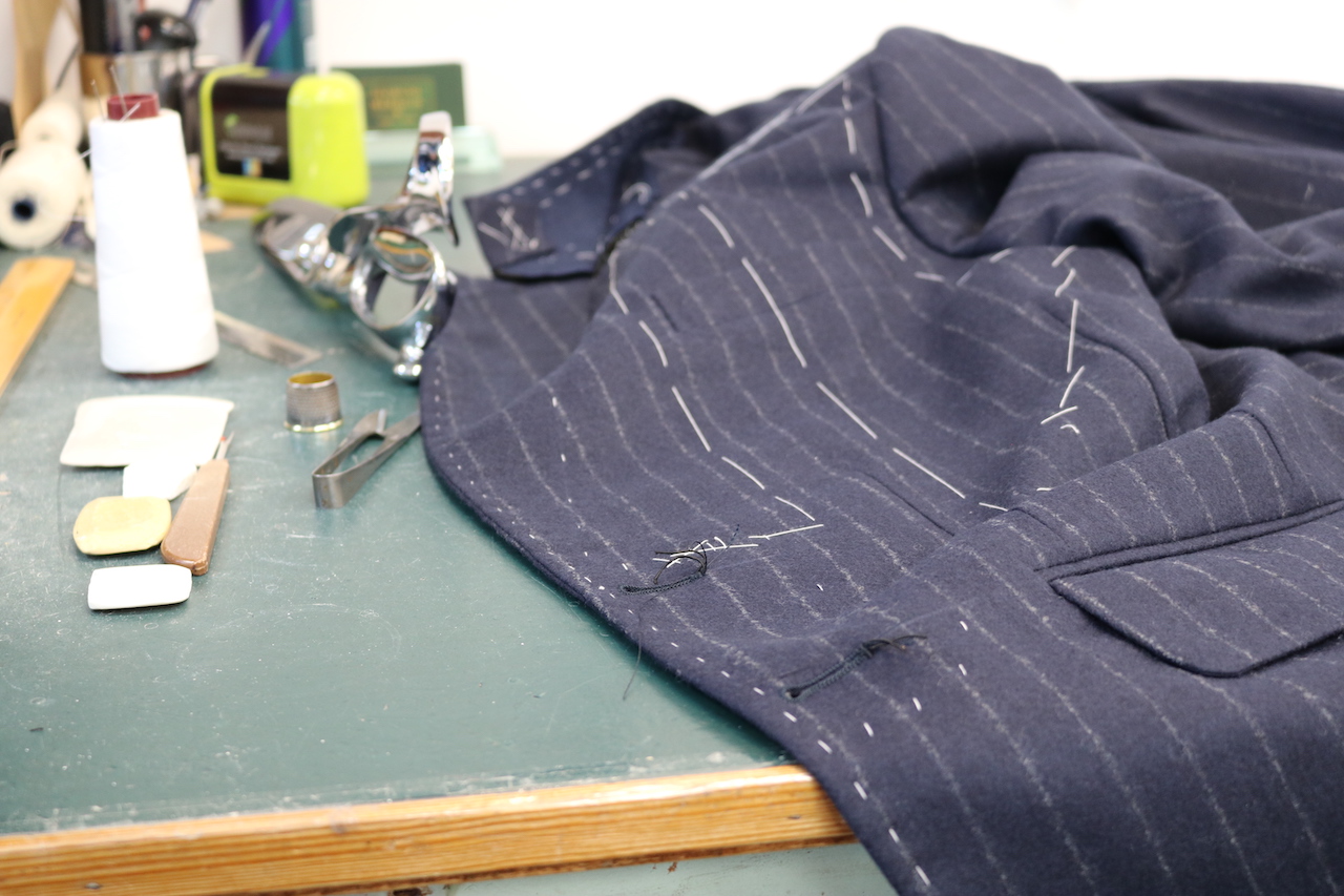 Tailored Jacket on Workbench with Tools